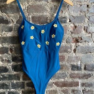Blue One-Piece Swimsuit with Yellow Daisy Appliqués